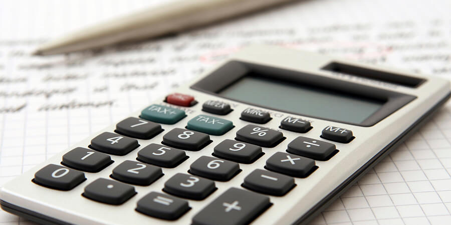 Close up of calculator and pencil.