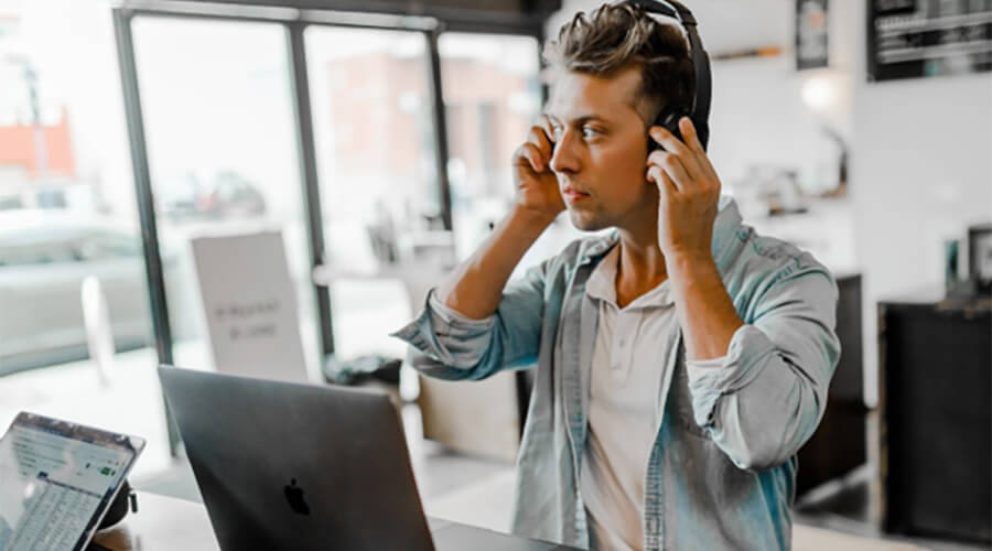 Man using a business phone in a modern office.