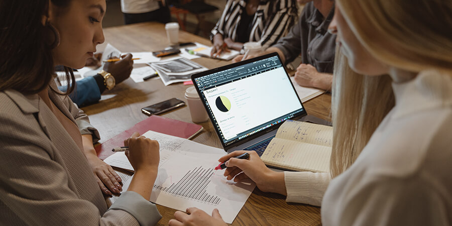 Educators recording grades.