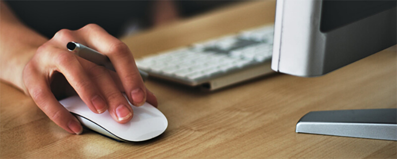 Female hand using a mouse.