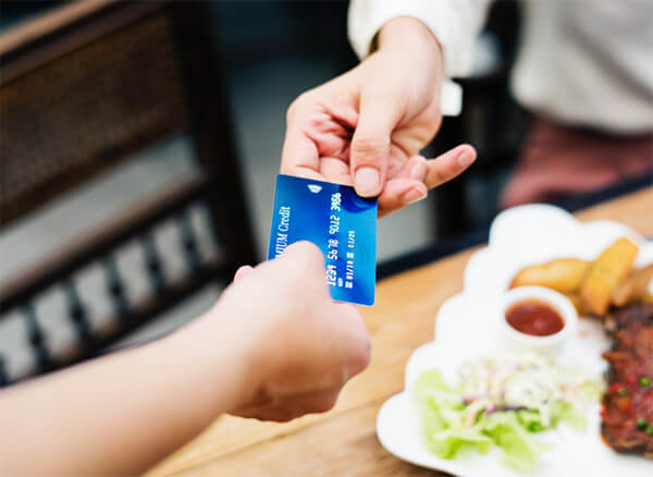 Customer paying with a contactless card.