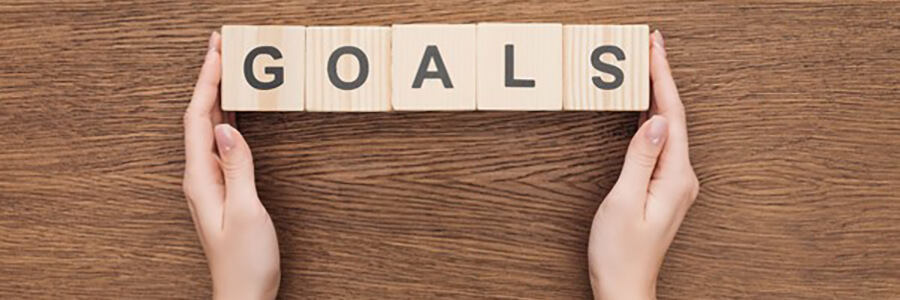 Wooden blocks spelling 'GOALS'