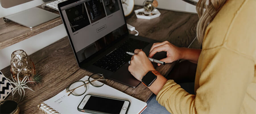 Woman working on a laptop at home.