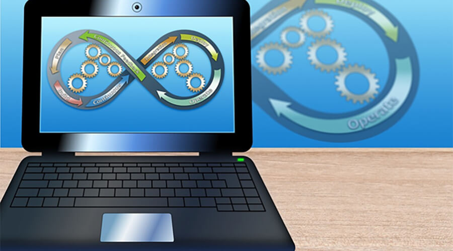 Laptop, infinity sign and cogs.