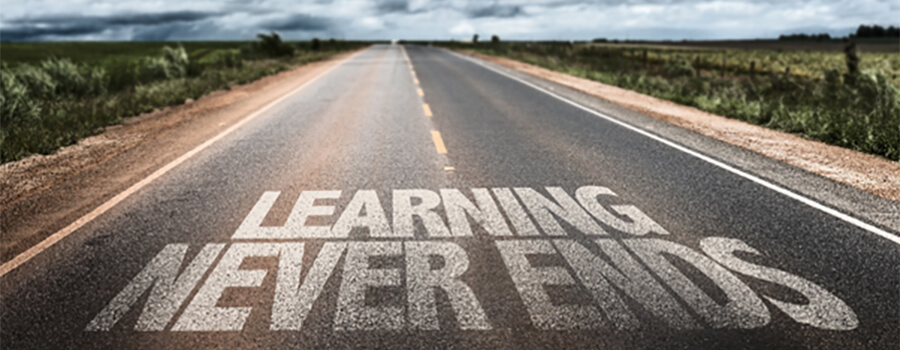 'Learning Never Ends' printed on highway.