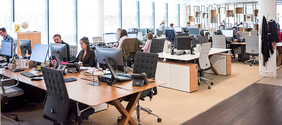 Modern open plan office with people working.