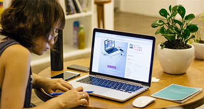 Female home-worker using laptop.