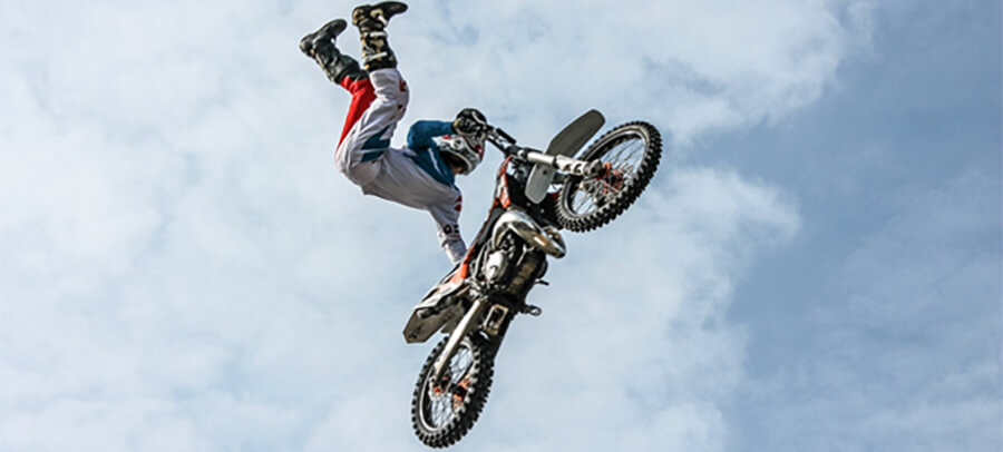 Stuntman jumping on a motorbike.