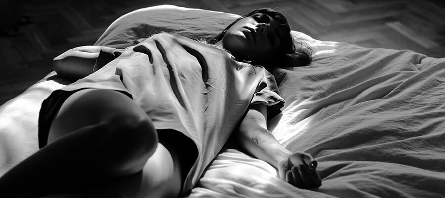 Black and white image of woman sleeping.